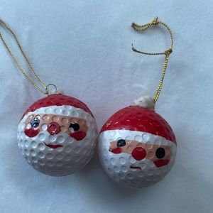 2 plastic ‘golf ball’ Santa faces. Have these a LONG LONG LONG time.